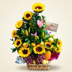 Frutero con girasoles, frutas variadas y flores en canasta elegante para regalo en Bogotá